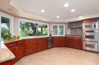 Step inside to find two expansive living areas, a large kitchen on Friendly Hills Country Club in California - for sale on GolfHomes.com, golf home, golf lot
