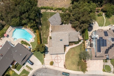 Step inside to find two expansive living areas, a large kitchen on Friendly Hills Country Club in California - for sale on GolfHomes.com, golf home, golf lot