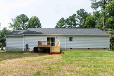 The home is located on an almost 1/2 acre lot at Lake Royale on River Golf and County Club at Lake Royale in North Carolina - for sale on GolfHomes.com, golf home, golf lot