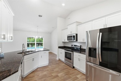 Beautifully maintained 4-bedroom, 2-bath pool home situated on a on Deep Creek Golf Club in Florida - for sale on GolfHomes.com, golf home, golf lot