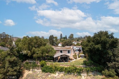 Step inside to find two expansive living areas, a large kitchen on Friendly Hills Country Club in California - for sale on GolfHomes.com, golf home, golf lot