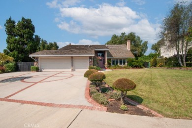 Step inside to find two expansive living areas, a large kitchen on Friendly Hills Country Club in California - for sale on GolfHomes.com, golf home, golf lot