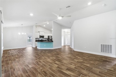 Beautifully maintained 4-bedroom, 2-bath pool home situated on a on Deep Creek Golf Club in Florida - for sale on GolfHomes.com, golf home, golf lot