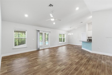 Beautifully maintained 4-bedroom, 2-bath pool home situated on a on Deep Creek Golf Club in Florida - for sale on GolfHomes.com, golf home, golf lot