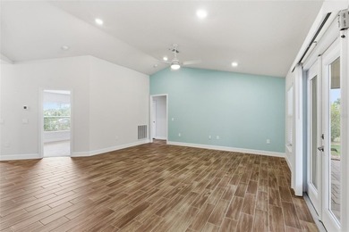 Beautifully maintained 4-bedroom, 2-bath pool home situated on a on Deep Creek Golf Club in Florida - for sale on GolfHomes.com, golf home, golf lot