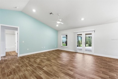 Beautifully maintained 4-bedroom, 2-bath pool home situated on a on Deep Creek Golf Club in Florida - for sale on GolfHomes.com, golf home, golf lot