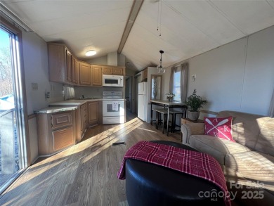 Welcome to Lake Life! This 1990 one bed/bath Park Model has been on Old North State Club at Uwharrie Point Golf community in North Carolina - for sale on GolfHomes.com, golf home, golf lot