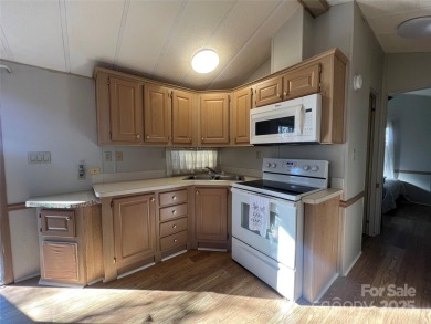 Welcome to Lake Life! This 1990 one bed/bath Park Model has been on Old North State Club at Uwharrie Point Golf community in North Carolina - for sale on GolfHomes.com, golf home, golf lot