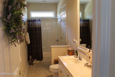 Welcome to your dream home! This custom-built residence is on Ocean Ridge Plantation in North Carolina - for sale on GolfHomes.com, golf home, golf lot