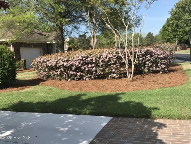 Welcome to your dream home! This custom-built residence is on Ocean Ridge Plantation in North Carolina - for sale on GolfHomes.com, golf home, golf lot