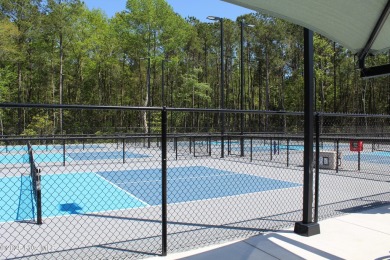 Welcome to your dream home! This custom-built residence is on Ocean Ridge Plantation in North Carolina - for sale on GolfHomes.com, golf home, golf lot