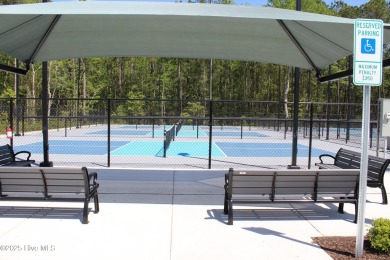 Welcome to your dream home! This custom-built residence is on Ocean Ridge Plantation in North Carolina - for sale on GolfHomes.com, golf home, golf lot