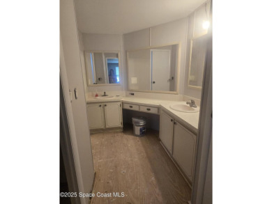Partially renovated home is ready for handy owners or landlord on Barefoot Bay Golf Course in Florida - for sale on GolfHomes.com, golf home, golf lot