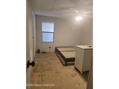 Partially renovated home is ready for handy owners or landlord on Barefoot Bay Golf Course in Florida - for sale on GolfHomes.com, golf home, golf lot