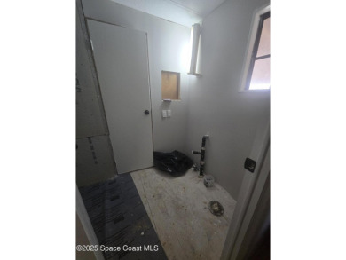 Partially renovated home is ready for handy owners or landlord on Barefoot Bay Golf Course in Florida - for sale on GolfHomes.com, golf home, golf lot