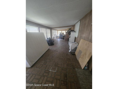 Partially renovated home is ready for handy owners or landlord on Barefoot Bay Golf Course in Florida - for sale on GolfHomes.com, golf home, golf lot