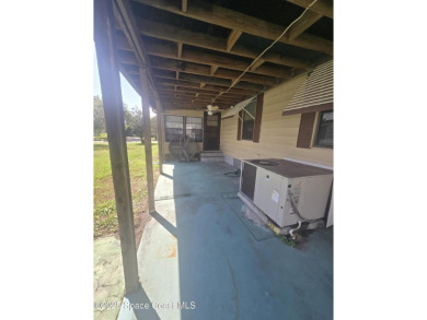 Partially renovated home is ready for handy owners or landlord on Barefoot Bay Golf Course in Florida - for sale on GolfHomes.com, golf home, golf lot