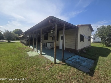 Partially renovated home is ready for handy owners or landlord on Barefoot Bay Golf Course in Florida - for sale on GolfHomes.com, golf home, golf lot