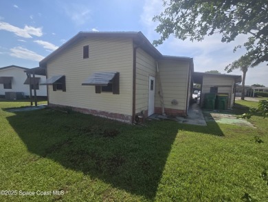 Partially renovated home is ready for handy owners or landlord on Barefoot Bay Golf Course in Florida - for sale on GolfHomes.com, golf home, golf lot