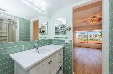 Find paradise in this one-of-a-kind lakefront villa in beautiful on Isla Del Sol Yacht and Country Club in Florida - for sale on GolfHomes.com, golf home, golf lot