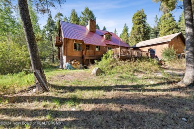 Pine trees, Mountains, Custom log home. True Wyo setting. 2 Wood on Star Valley RV Golf Course in Wyoming - for sale on GolfHomes.com, golf home, golf lot