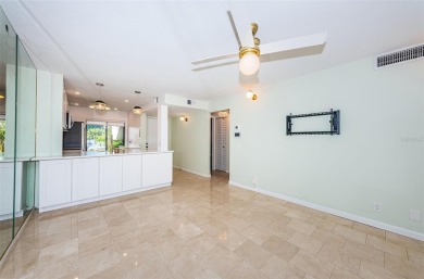 Find paradise in this one-of-a-kind lakefront villa in beautiful on Isla Del Sol Yacht and Country Club in Florida - for sale on GolfHomes.com, golf home, golf lot