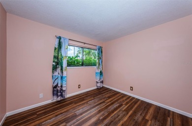 Find paradise in this one-of-a-kind lakefront villa in beautiful on Isla Del Sol Yacht and Country Club in Florida - for sale on GolfHomes.com, golf home, golf lot