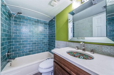 Find paradise in this one-of-a-kind lakefront villa in beautiful on Isla Del Sol Yacht and Country Club in Florida - for sale on GolfHomes.com, golf home, golf lot