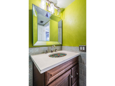 Find paradise in this one-of-a-kind lakefront villa in beautiful on Isla Del Sol Yacht and Country Club in Florida - for sale on GolfHomes.com, golf home, golf lot