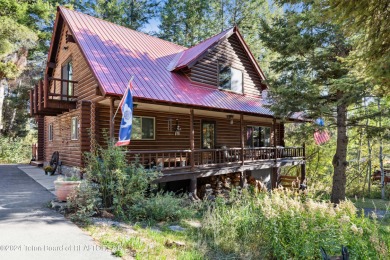 Pine trees, Mountains, Custom log home. True Wyo setting. 2 Wood on Star Valley RV Golf Course in Wyoming - for sale on GolfHomes.com, golf home, golf lot