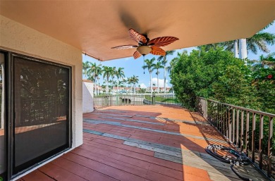 Find paradise in this one-of-a-kind lakefront villa in beautiful on Isla Del Sol Yacht and Country Club in Florida - for sale on GolfHomes.com, golf home, golf lot