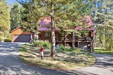 Pine trees, Mountains, Custom log home. True Wyo setting. 2 Wood on Star Valley RV Golf Course in Wyoming - for sale on GolfHomes.com, golf home, golf lot