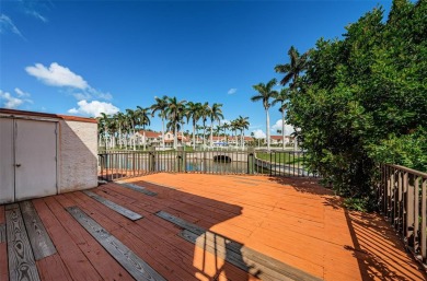 Find paradise in this one-of-a-kind lakefront villa in beautiful on Isla Del Sol Yacht and Country Club in Florida - for sale on GolfHomes.com, golf home, golf lot