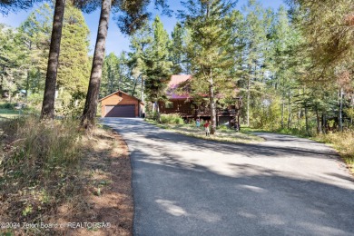 Pine trees, Mountains, Custom log home. True Wyo setting. 2 Wood on Star Valley RV Golf Course in Wyoming - for sale on GolfHomes.com, golf home, golf lot