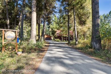 Pine trees, Mountains, Custom log home. True Wyo setting. 2 Wood on Star Valley RV Golf Course in Wyoming - for sale on GolfHomes.com, golf home, golf lot