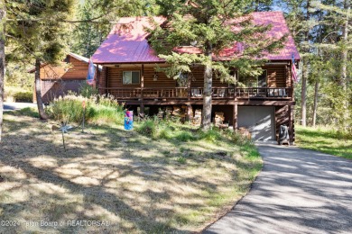 Pine trees, Mountains, Custom log home. True Wyo setting. 2 Wood on Star Valley RV Golf Course in Wyoming - for sale on GolfHomes.com, golf home, golf lot