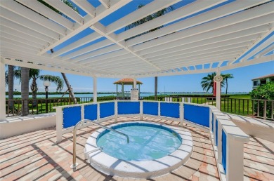 Find paradise in this one-of-a-kind lakefront villa in beautiful on Isla Del Sol Yacht and Country Club in Florida - for sale on GolfHomes.com, golf home, golf lot