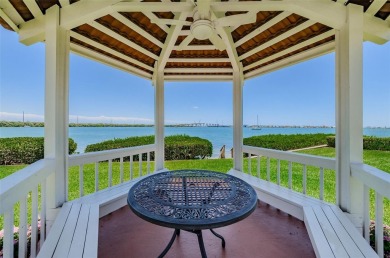 Find paradise in this one-of-a-kind lakefront villa in beautiful on Isla Del Sol Yacht and Country Club in Florida - for sale on GolfHomes.com, golf home, golf lot