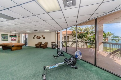 Find paradise in this one-of-a-kind lakefront villa in beautiful on Isla Del Sol Yacht and Country Club in Florida - for sale on GolfHomes.com, golf home, golf lot