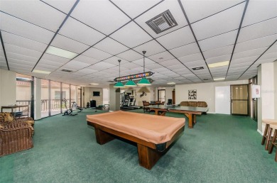 Find paradise in this one-of-a-kind lakefront villa in beautiful on Isla Del Sol Yacht and Country Club in Florida - for sale on GolfHomes.com, golf home, golf lot