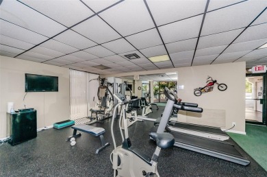 Find paradise in this one-of-a-kind lakefront villa in beautiful on Isla Del Sol Yacht and Country Club in Florida - for sale on GolfHomes.com, golf home, golf lot