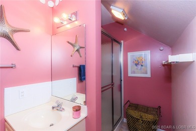 Enjoy panoramic lake views & resort-style living in this on Bear Creek Valley Golf Club in Missouri - for sale on GolfHomes.com, golf home, golf lot