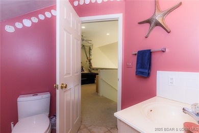 Enjoy panoramic lake views & resort-style living in this on Bear Creek Valley Golf Club in Missouri - for sale on GolfHomes.com, golf home, golf lot