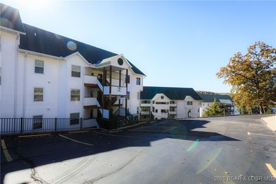 Enjoy panoramic lake views & resort-style living in this on Bear Creek Valley Golf Club in Missouri - for sale on GolfHomes.com, golf home, golf lot