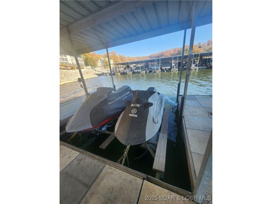 Enjoy panoramic lake views & resort-style living in this on Bear Creek Valley Golf Club in Missouri - for sale on GolfHomes.com, golf home, golf lot