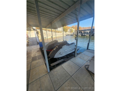 Enjoy panoramic lake views & resort-style living in this on Bear Creek Valley Golf Club in Missouri - for sale on GolfHomes.com, golf home, golf lot