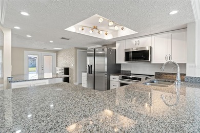 This beautifully updated Gulf Harbors waterfront home delivers on Gulf Harbors Golf Course in Florida - for sale on GolfHomes.com, golf home, golf lot