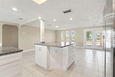 This beautifully updated Gulf Harbors waterfront home delivers on Gulf Harbors Golf Course in Florida - for sale on GolfHomes.com, golf home, golf lot