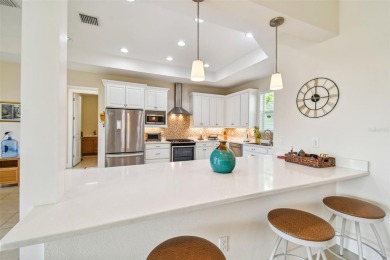 Absolutely stunning three-bedroom, two-bath, PLUS OFFICE on Apollo Beach Golf and Sea Club in Florida - for sale on GolfHomes.com, golf home, golf lot
