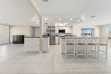 This beautifully updated Gulf Harbors waterfront home delivers on Gulf Harbors Golf Course in Florida - for sale on GolfHomes.com, golf home, golf lot